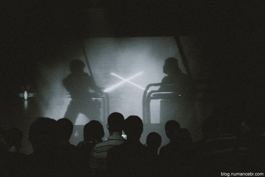 silhouette of people on a concert